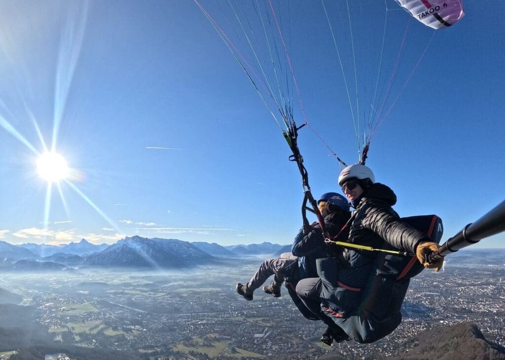 Tandem paragliding pilot in the air